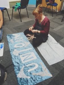 Sara putting the finishing touches to the UNION19 banner